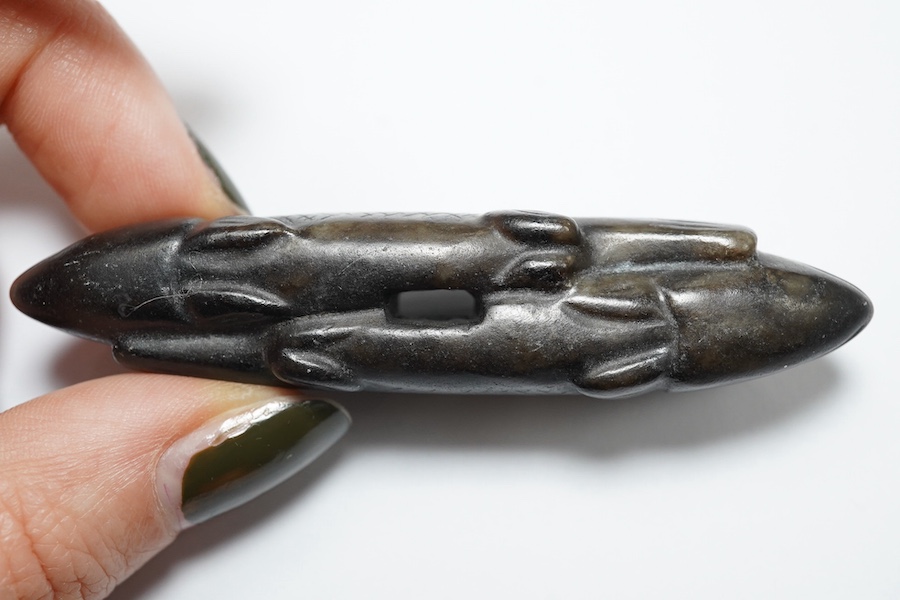 A Chinese black and white jade 'fish' sword fitting, Song or later